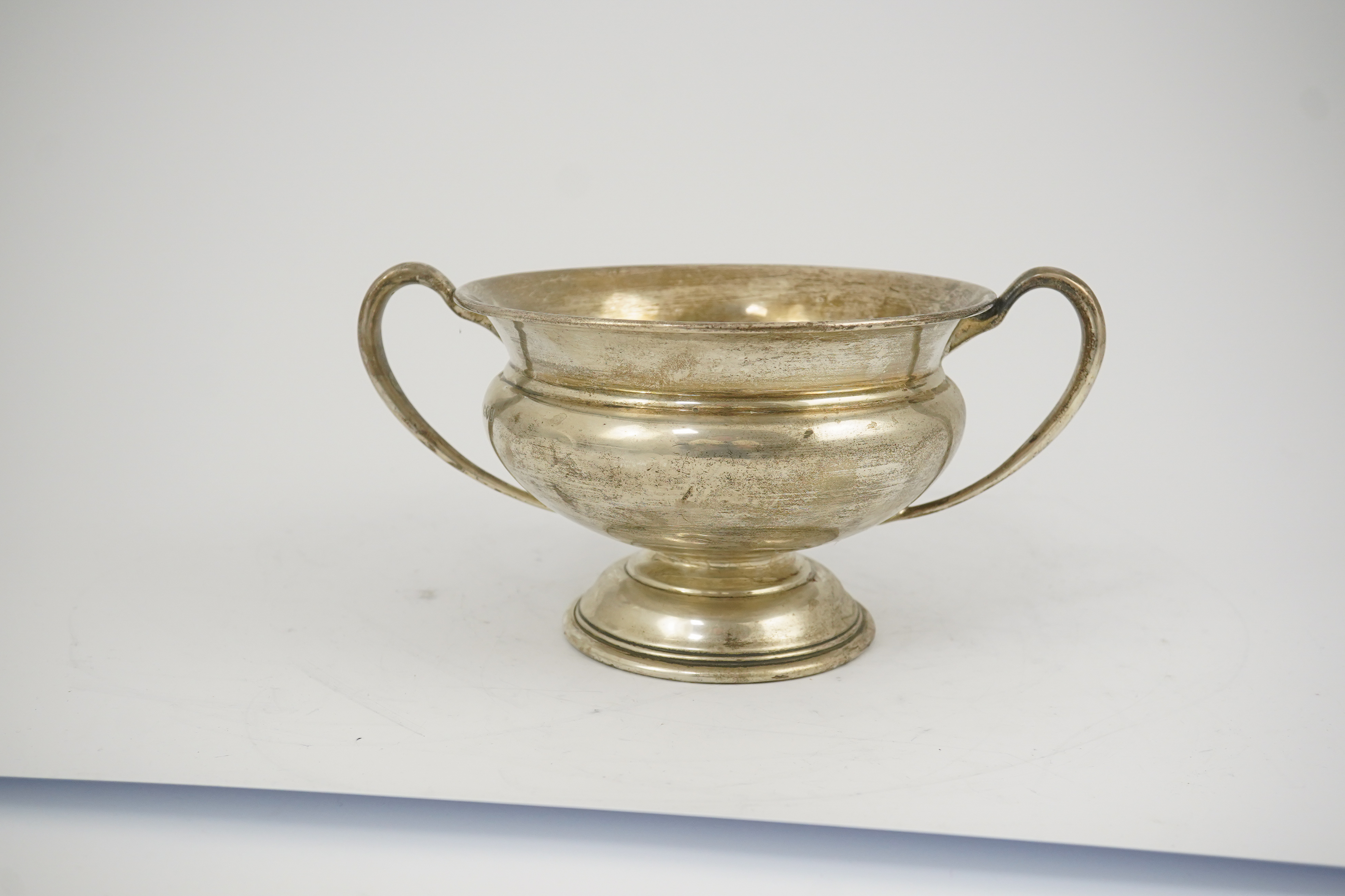 A George V silver two handled pedestal bowl, by Charles Edwards